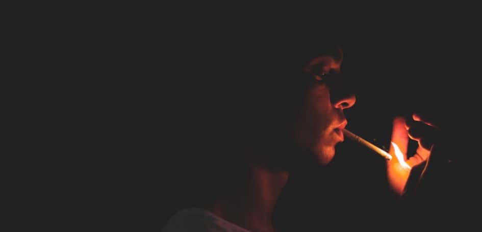 man-lighting-cigarette