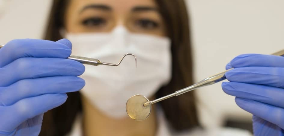 Oasis Dental Studio - Pros and Cons of Overseas Dental Holidays - 4 dentist-holding-tools