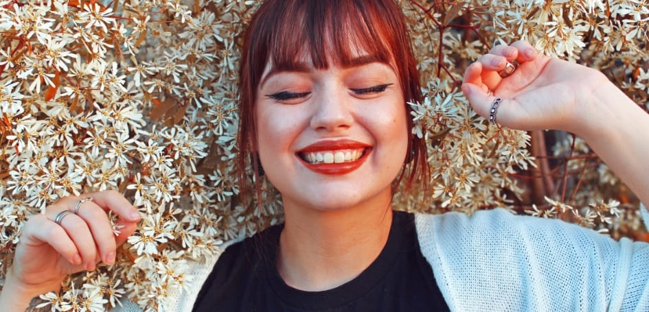 woman-smiling-flowers