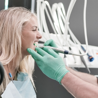 A patient during the tooth decay treatment at Oasis Dental Studio Clinic, 1