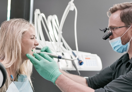A patient with the dentist during the tooth decay treatment at Oasis Dental Studio Clinic, 2